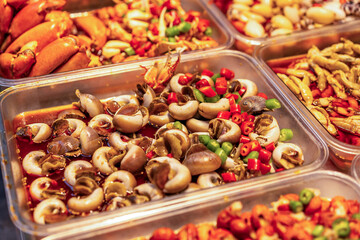 Vibrant Seafood Delicacies Marinated in Spicy Sauce for Culinary Enthusiasts