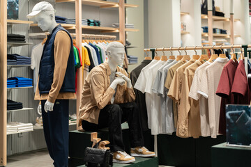 Man clothing displayed used mannequin in the boutique window. Retail and consumerism