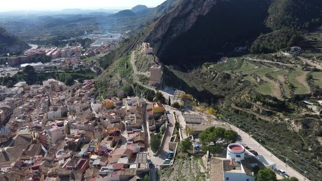 Aerial reveal of the castle, Blay tower and village of Jijona, Spain