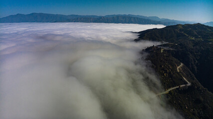 APRIL 2023, SANTA BARBARA, CA - USA - Aerial view of fogline above mountains near Santa Barbara on Route 154