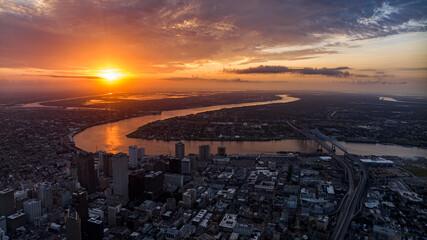 JULY 14, 2023 - NEW ORLEANS - LA - USA - aerial view of New Orleans skyline with Mississippi River in backgound at sunrise