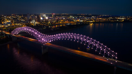 JULY 6, 2023 - MEMPHIS, TN, USA - Hernando De Soto Bridge LIGHT SHOW - Memphis, Tennessee over Mississippi River at night