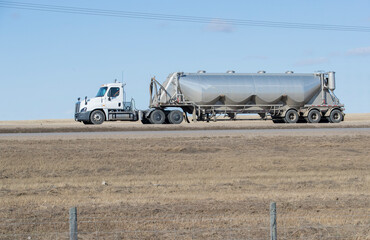 Heavy Cargo on th eroad. A truck hauling freight along a highway. Taken in Alberta, Canada