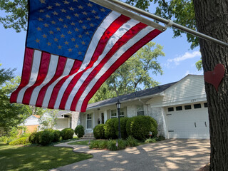 JULY 4, 2023, WEBSTER GROVES, ST. LOUIS, MO., USA - home of famous Americana photographer Joe Sohm with American flag waving