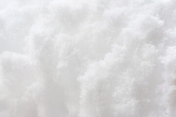 Texture of white snow close-up, natural background.