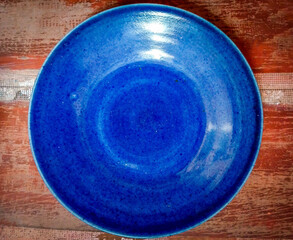 vintage ceramic blueish platter on a wooden background