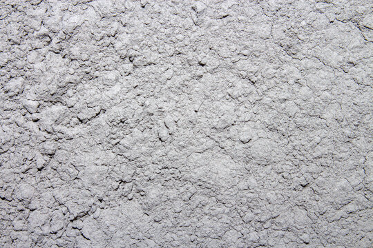 The texture of the cement.The background is made of cement.The grey cement of the m600 brand is high-strength.