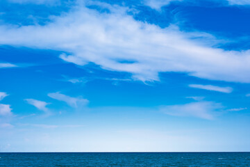 Nature of the beach and sea Summer with sunshine, sandy beaches, clear blue waters sparkling against the blue sky. On an island with good ecology and environment Background for summer vacation concept