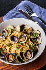 Spaghetti alle vongole is a pasta dish consisting of spaghetti cooked with fresh clams, originating in the coastal regions of southern Italy