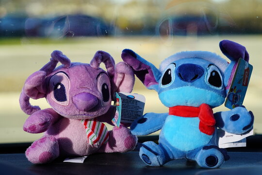 Stuffed animal toys of Angel and Stitch from Lilo and Stitch cartoon. 