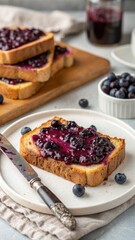 Fresh Blueberry Jam Spread on Toast with Berries and Jar