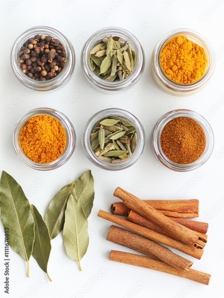 Poster small jars filled with colorful spices, complemented by aromatic bay leaves and cinnamon sticks, cre