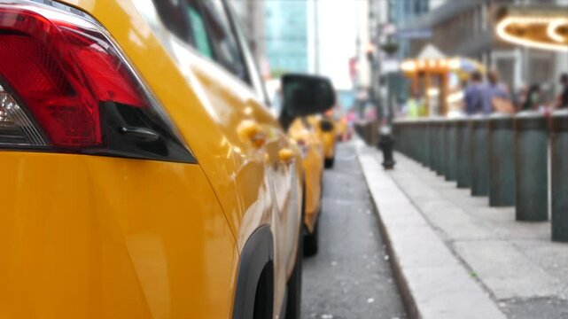 New York City Grand Central Terminal railway station, 42 street. Manhattan Midtown. Yellow taxi cab row, car transport on Pershing Square, NYC, USA. American urban road traffic, people pedestrians.