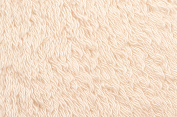 white plush fabric texture background, background pattern of soft warm light orange material