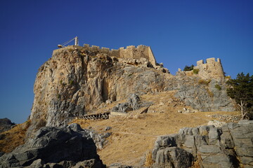 Fototapeta premium steep cliffs surrounding the acropolis of Lindos 