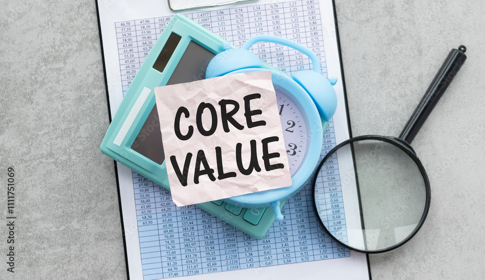 Fototapete core value text on paper on calculator write alarm clock.