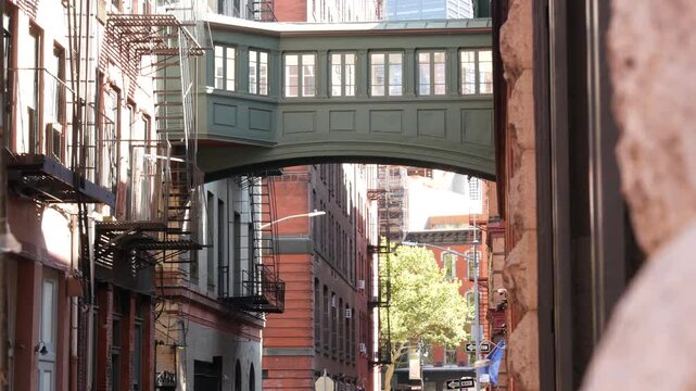 New York City Staple street skybridge. Vintage retro industrial architecture, red brick building. American old historic cooper elevated sky bridge Manhattan landmark, USA. Fire escape ladder.
