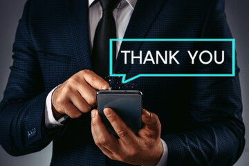 Thank you message concept. A person holding smartphone with glowing 