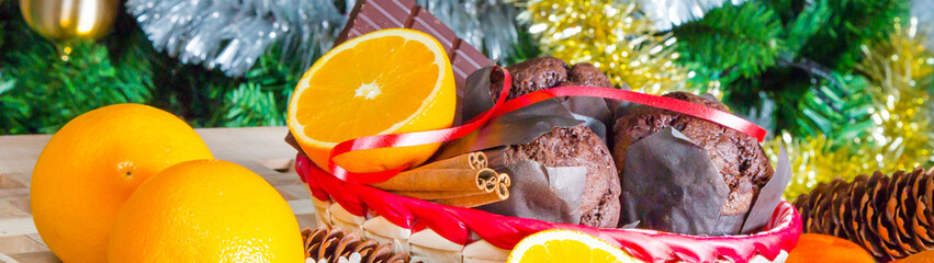 cupcakes, cinnamon sticks, oranges, chocolate and Christmas tree