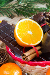 Close up orange and chocolate on Christmas tree background