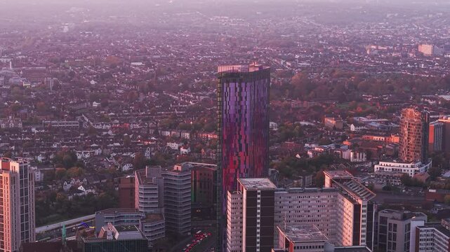 Aerial view towards Croydon Saffron towers high rise property and sunlit evening downtown cityscape