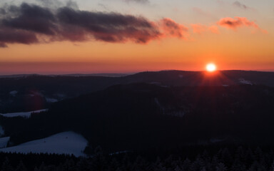 Fototapeta premium Colorful sunset over the Czech countryside. View of the Krkonoše mountains from the Teplice-Adršpašská rocks.