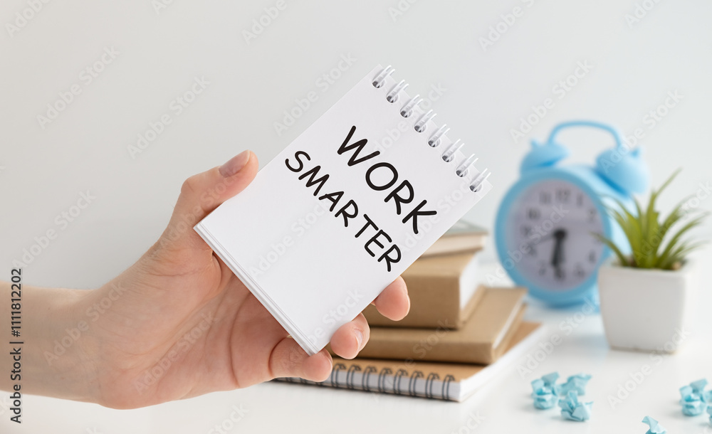 Poster man showing work smarter text on notepad