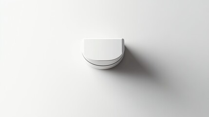 A white box with a half circle cutout sits on a white surface.