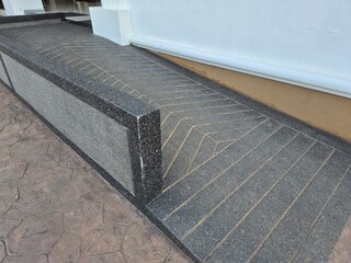 Wheelchair ramp, inclined plane was installs in all building to make a convenience for handicap people. 
Standard construction building must have inclined slope.