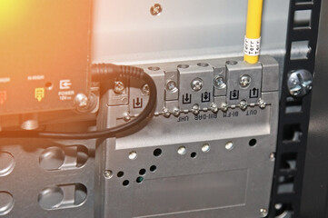 Connection of modules in the telecommunication rack of network equipment. Soft focus.Sunflare. 