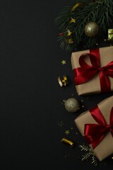 Beautiful gift boxes tied with bows and Christmas decorations on color background 