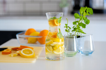 Fototapeta premium Preparing Homemade Lemonade From Lemons And Oranges Is A Refreshing Activity
