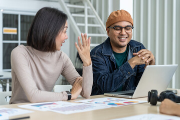 Fototapeta premium Happy diverse group Asian business start up freelance team analyzing statistics financial. Group Team of business people meeting conference discussion various topic corporate concept in office.