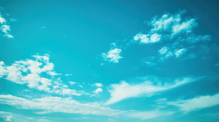 Tranquil blue sky background with soft clouds for serene desktop aesthetic