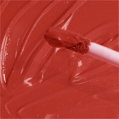 Red cosmetic smudge, smear satin finish lip gloss swatches with applicator brush