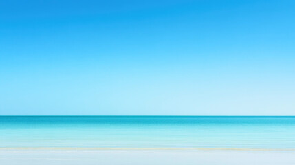Endless gradient blue sky meets serene waters on a clear day