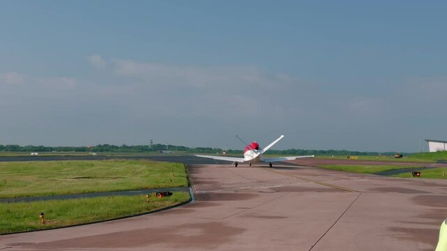Cirrus G2 Vision Jet Preparing To Take Off At Manchester International Airport In England, UK. - tracking shot