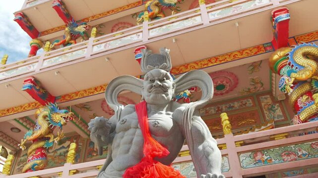 God statue in a Chinese temple during a sunny day . Thepsathit Phra Kiti Chalerm Chinese shrine. Bang Saen, Chonburi Thailand Southeast Asia