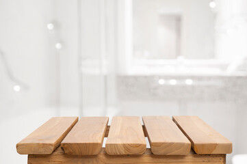 Wooden planks podium for bathing and spa products on blurred bathroom background