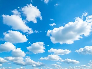 Obraz premium Big billowing clouds floating across a bright blue sky, showcasing a peaceful and serene natural landscape perfect for sky and cloud lovers.