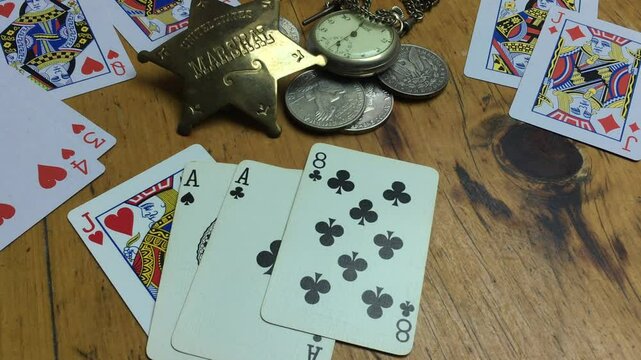 Dead man's hand . Aces and two Eights, named after Wild Bill Hickok who was killed with it in 1876.Deadwood, Dakota Territory,