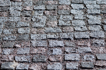 walkway made of square granite blocks close up