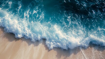 Fototapeta premium Aerial View of a Wave Breaking on a Sandy Beach