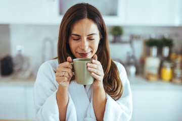 Woman Enjoying Morning Coffee in Cozy Kitchen Setting