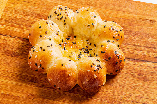 Fatir, uzbek flatbread on old wooden background
