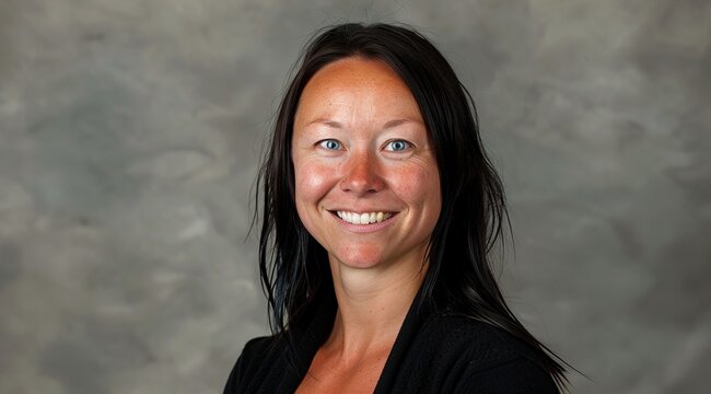Smiling black-haired woman portrait in studio 