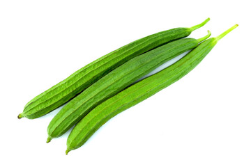 Group of angled luffa, Chinese okra, dish cloth gourd, ridged gourd, or sponge gourd, isolated on white background top view flat lay, stack.