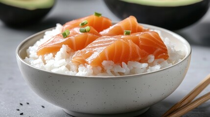 Fresh Salmon Slices on Rice in Elegant Bowl with Chives
