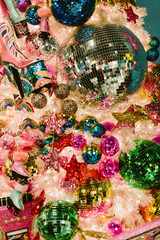 A Christmas tree with many colorful balls and a star