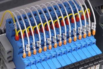 Connection of electrical modules using insulated mounting wires. Close-up. Soft focus.